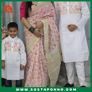 কাপল সেট (শাড়ি পাঞ্জাবি এবং বেবি পাঞ্জাবি) বিবরণ: এই কাপল সেটটি সম্পূর্ণ পরিবারের জন্য উপযুক্ত এবং বিশেষ দিনে আপনাদের পুরো পরিবারের সাজকে করে তুলবে আকর্ষণীয় ও স্মরণীয়। বিশেষ করে ঐতিহ্যবাহী ও আরামদায়ক হাফ সিল্ক এবং ধুপিয়ান কটনের কাপড় দিয়ে তৈরি এই কাপল সেটের প্রতিটি টুকরো আপনাকে অনন্যতার অনুভূতি দেবে। প্রিয়জন এবং ছোট্ট সোনামণির জন্য এমন অনন্য ডিজাইনের একটি কাপল সেট সংগ্রহের সুযোগ হাতছাড়া করবেন না! বৈশিষ্ট্য: শাড়ি: এই হাফ সিল্ক শাড়িটি ১২ হাত লম্বা এবং হ্যান্ড প্রিন্টের কারুকাজে সমৃদ্ধ। সিল্কের মসৃণ স্পর্শ এবং হ্যান্ড প্রিন্টের নান্দনিকতা, শাড়িটিকে আরও মনোমুগ্ধকর করে তোলে। এটি যে কোনো উৎসব বা বিশেষ দিনের জন্য একদম মানানসই, যেখানে আপনি হয়ে উঠবেন সবার মধ্যমণি। এই শাড়িটি কালার গ্যারান্টিসহ দেয়া হয়েছে, তাই এটি ব্যবহারে রঙের উজ্জ্বলতা বজায় থাকবে বহুদিন। পুরুষদের পাঞ্জাবি: ধুপিয়ান কটনের তৈরি এই পাঞ্জাবিটি হ্যান্ড প্রিন্টের কাজের জন্য বিশেষভাবে তৈরি। কটনের আরামদায়ক এবং শীতল স্পর্শ প্রতিটি দিনেই আপনার আরামকে বাড়িয়ে তুলবে। বিশেষ করে যেকোনো পারিবারিক অনুষ্ঠান বা মিলনমেলায় এটি আপনাকে ঐতিহ্যবাহী ও স্টাইলিশ লুক দেবে। বেবি পাঞ্জাবি: আপনার ছোট্ট সোনামণির জন্য এই আরামদায়ক ধুপিয়ান কটনের পাঞ্জাবিটি একদম উপযুক্ত। বাচ্চাদের ত্বকের জন্য উপযোগী এবং আরামদায়ক এই পাঞ্জাবিটি দেখতে যেমন সুন্দর তেমনই তার জন্য মিষ্টি লুক এনে দেবে। এর হ্যান্ড প্রিন্ট কাজের কারুকাজ তাকে সবার মাঝে আলাদা করে তুলবে। কালার গ্যারান্টি: প্রতিটি পোশাকেই রয়েছে কালার গ্যারান্টি, যা বহুদিন ব্যবহারের পরও উজ্জ্বলতা এবং রঙের স্থায়িত্ব বজায় রাখবে। তাই আপনি নিশ্চিত থাকতে পারেন যে, এই কাপল সেটটি দীর্ঘদিন ধরে তার রঙ ও মান বজায় রাখবে। বিশেষত্ব: এই কাপল সেটটি এমনভাবে তৈরি করা হয়েছে যাতে পুরো পরিবারের জন্য একটি সুন্দর ঐক্যপূর্ণ লুক প্রদান করে। ঐতিহ্যবাহী পোশাকের সৌন্দর্য এবং আধুনিক ডিজাইনের সংমিশ্রণ এই সেটকে সকল বয়সের জন্য মানানসই করে তুলেছে। আপনার পরিবারকে ঐতিহ্য ও ভালোবাসার বন্ধনে আবদ্ধ করে বিশেষ দিনগুলোতে তাদের অনন্য রূপে গড়ে তুলুন। অর্ডার করতে দেরি করবেন না—এখনই অর্ডার করে পুরো ফ্যামিলির জন্য এই বিশেষ কাপল সেটটি সংগ্রহ করুন এবং প্রতিটি মুহূর্তকে আরো রঙিন ও স্মরণীয় করে তুলুন!